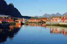 Photo of houses, bridge and panorama of Norwegian city Tromso beyond the Arctic circle from mountain in Norwegian fjords.