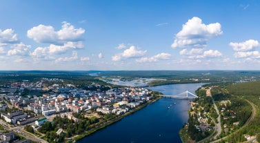 Rovaniemi Finland, panorama of the city with Kemijoki river in the back and Ounasvaara fell with the city heart at the left.