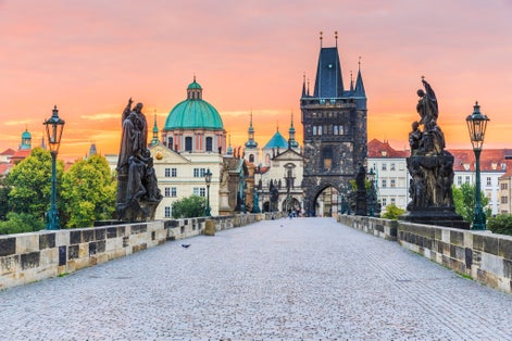 Photo of Prague, Czech Republic. Charles Bridge and Old Town Tower at sunrise.