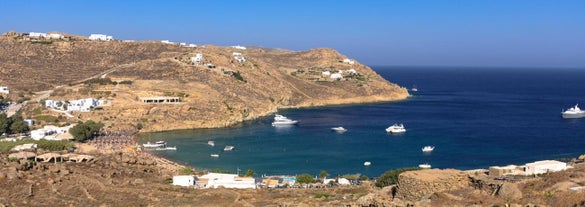 Photo of aerial view to the popular bay of Ornos on the island of Mykonos, Greece.