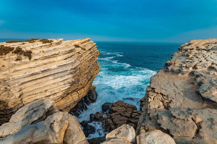 photo of view of Azure impressions: Ocean, sky, and cliffs merge in a kaleidoscope of colors, offering a captivating glimpse of Portugal's coastal wonders.