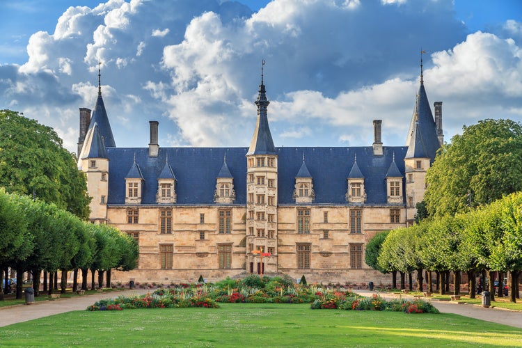 Photo of the 15th century historical monument Ducal Palace of Nevers (Palais ducal de Nevers) is the first of the river Loire‘s castles with its renaissance façade surrounded by the polygon turrets, France.