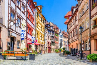 Photo of aerial view of the historic city center of Freiburg im Breisgau from famous old Freiburger Minster in beautiful evening light at sunset, Germany.