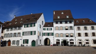 View of the Old Town of Basel with red stone Munster cathedral and the Rhine river, Switzerland.