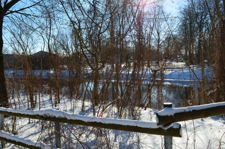 Photo of snow and ice landscape in winter. Ems River and Emssee in Warendorf Germany.