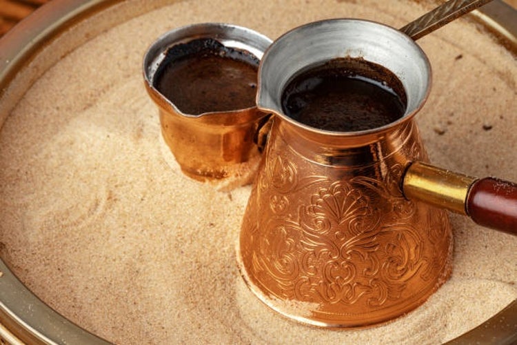 Turkish coffee is prepared in copper pots and hot sand.jpg