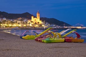 Photo of Sand beach and historical Old Town in mediterranean resort Sitges near Barcelona, Costa Dorada, Catalonia, Spain.