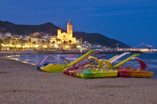 Photo of Sand beach and historical Old Town in mediterranean resort Sitges near Barcelona, Costa Dorada, Catalonia, Spain.