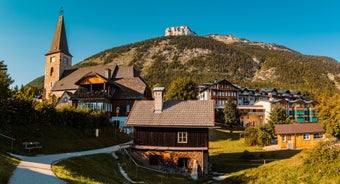 Photo of Tauplitz Alp ski areal view from lift at mountain's cabins, Austria.