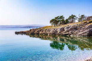 photo of aerial panoramic view of beautiful town of Lovran and sea walkway in Croatia.