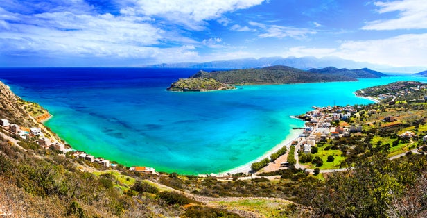 Photo of beautiful view of Plaka village, beach and Spinalonga island.
