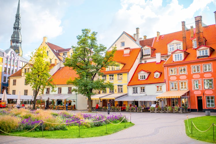 Photo of Livu square with beautiful flowerbed and buildings in the old town of Riga, Latvia