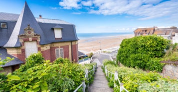 photo of Port of Deauville and city skyline in a sunny summer day, Normandy, France.