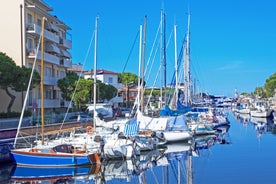 Photo of Cervia's canal, where the Salt Museum is located, with reflections on the water ,Italy.