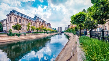 Antique building view in Old Town Bucharest city - capital of Romania and Dambrovita river. Bucharest, Romania, Europe.