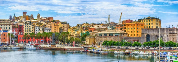 Famous buildings, gondolas and monuments by the Rialto Bridge of Venice on the Grand Canal, Italy.