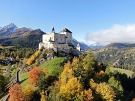 Photo of  beautiful Scuol town in Swiss Alps and Inn river, Switzerland.