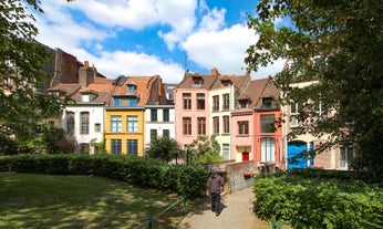 Photo of traditional half-timbered houses on picturesque canals in La Petite France in the medieval fairytale town of Strasbourg, France.