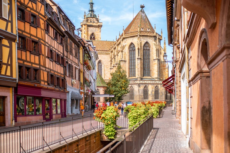 Photo of cityscaspe view on the old town with saint Martin cathedral in Colmar, famous French town in Alsace region, France.