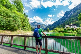 photo of historic town of Berchtesgaden with famous Watzmann mountain in the background on a sunny day with blue sky and clouds in springtime, National Park Berchtesgaden Land, Upper Bavaria, Germany.