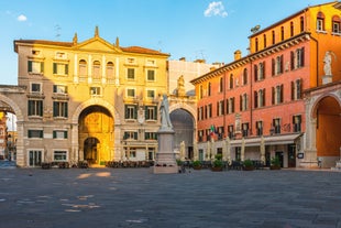 Photo of beautiful view of canal with statues on square Prato della Valle and Basilica Santa Giustina in Padova (Padua), Veneto, Italy.