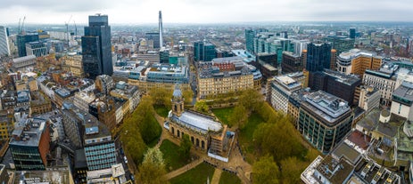 Aerial drone view of Manchester city in UK on a beautiful sunny day.