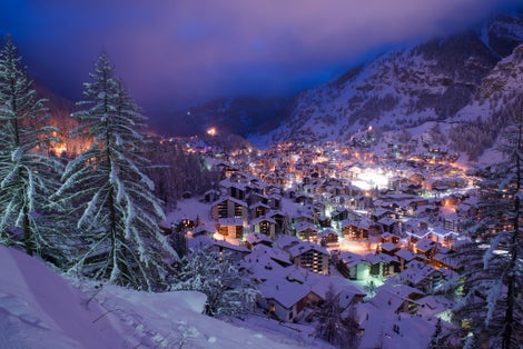 photo of aerial view on Zermatt valley and Matterhorn peak at dusk with fresh snow in Switzerland.