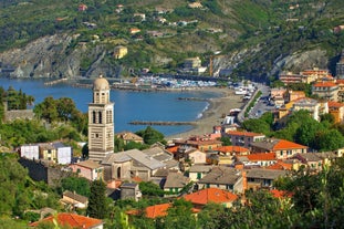 Photo of Riomaggiore with colorful houses along the coastline, one of the five famous coastal village in the Cinque Terre National Park, Liguria, Italy.