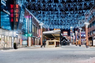 Rovaniemi Finland, panorama of the city with Kemijoki river in the back and Ounasvaara fell with the city heart at the left.