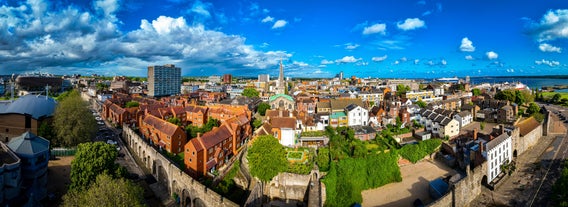 Photo of view of Gloucester Cathedral Church of St Peter and the Holy and Indivisible Trinity on a sunny day, UK.