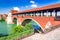 photo of Pavia, Italy. Ponte Coperto (covered bridge) or the Ponte Vecchio a stone arch bridge over the Ticino River.