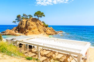 photo of aerial panoramic drone point of view Cabo Roig coastline with blue Mediterranean Seascape view, residential buildings near sandy beach at sunny summer day. Province of Alicante, Costa Blanca. Spain.