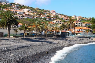 Photo of beach aerial view of Machico bay and Cristiano Ronaldo International airport in Madeira, Portugal.