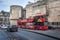  City Sightseeing Hop-On Hop-Off bus in front of National Museum of Scotland in Edinburgh city.