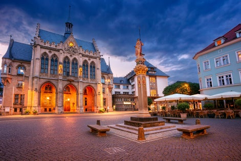 photo of view of Erfurt, Germany. Cityscape image of old town Erfurt, Thuringia, Germany with the neo-Gothic Town Hall on Fischmarkt square at sunrise.