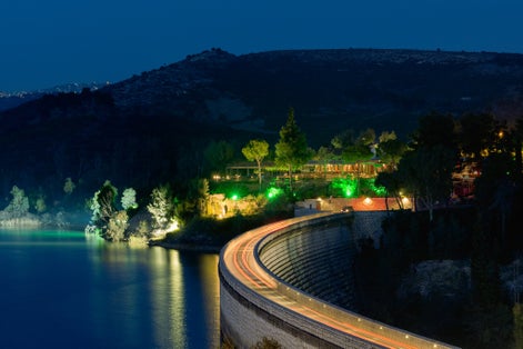 photo of night view of traffic at the barrier of Marathon in Greece.