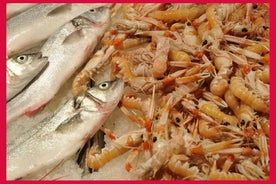 Local market visit and private cooking class at a Cesarina's home in Ostuni