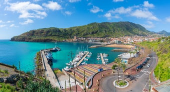 Photo of beach aerial view of Machico bay and Cristiano Ronaldo International airport in Madeira, Portugal.