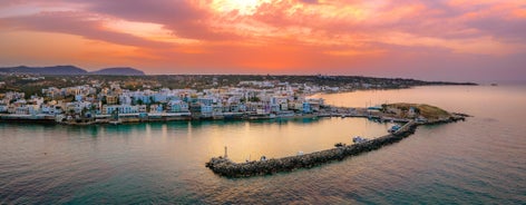 Photo of aerial view of Malia beach and small island with Church of Transfiguration, Heraklion, Crete, Greece.