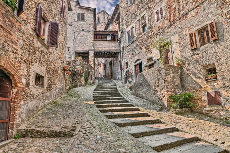 photo of view of Anghiari, Arezzo, Tuscany, Italy: picturesque old narrow alley with staircase in the medieval village, Arezzo, Italy.