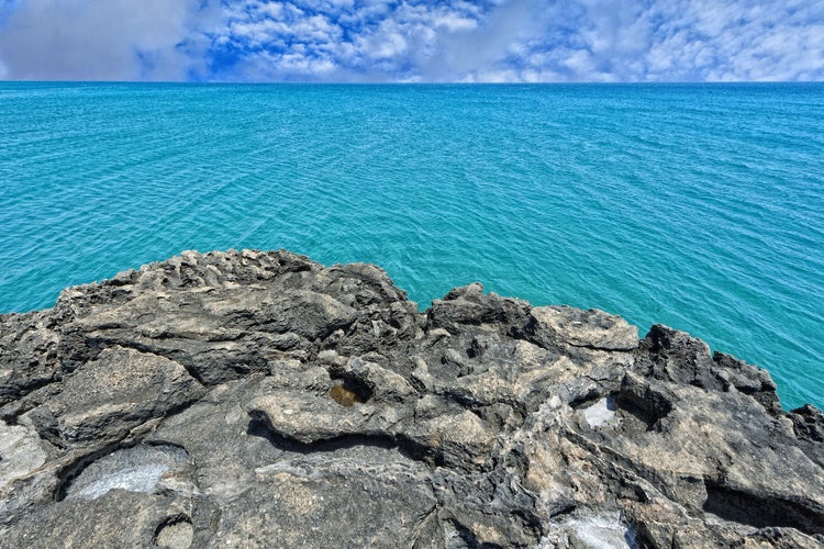 Photo of beautiful blue water and sky of Noto, Italy.