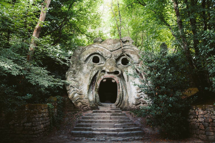 Orcus mouth sculpture at famous Parco dei Mostri (Park of the Monsters), also named Sacro Bosco (Sacred Grove) or Gardens of Bomarzo in Bomarzo, province of Viterbo, northern Lazio, Italy