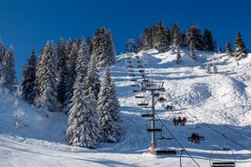 Photo of The winter view on the montains and ski lift station in French Alps near Chamonix Mont-Blanc.