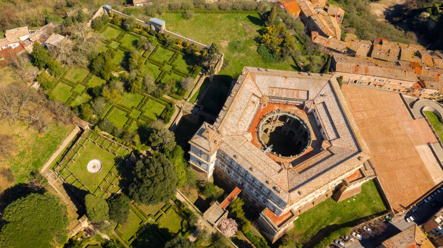 Aerial view of The Villa Farnese (in italian Palazzo Farnese), a mansion in the town of Caprarola, near Viterbo, Northern Lazio, Italy. Birds eye of the ancient village of Caprarola, in Tuscia.