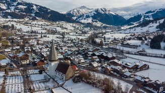 photo of an aerial view of Gstaad in winter. Village and holiday resort in the Swiss Alps.