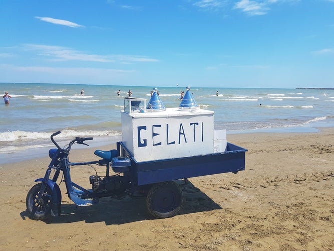 Selling ice cream on the beach, Barletta, Italy, Puglia