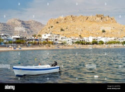 Photo of panoramic aerial view of Lindos bay, village and Acropolis, Rhodes, Greece.