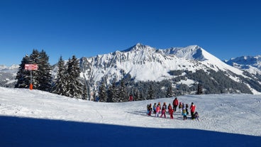 photo of an aerial view of Gstaad in winter. Village and holiday resort in the Swiss Alps.