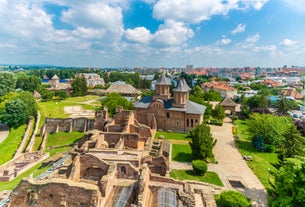 Antique building view in Old Town Bucharest city - capital of Romania and Dambrovita river. Bucharest, Romania, Europe.