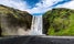 photo of skogafoss waterfall in southern Iceland during a summer day.